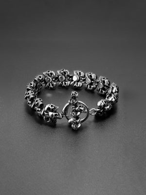 Antiqued Skull Link Biker Bracelet – toggle clasp, closed on dark surface | XoKool
