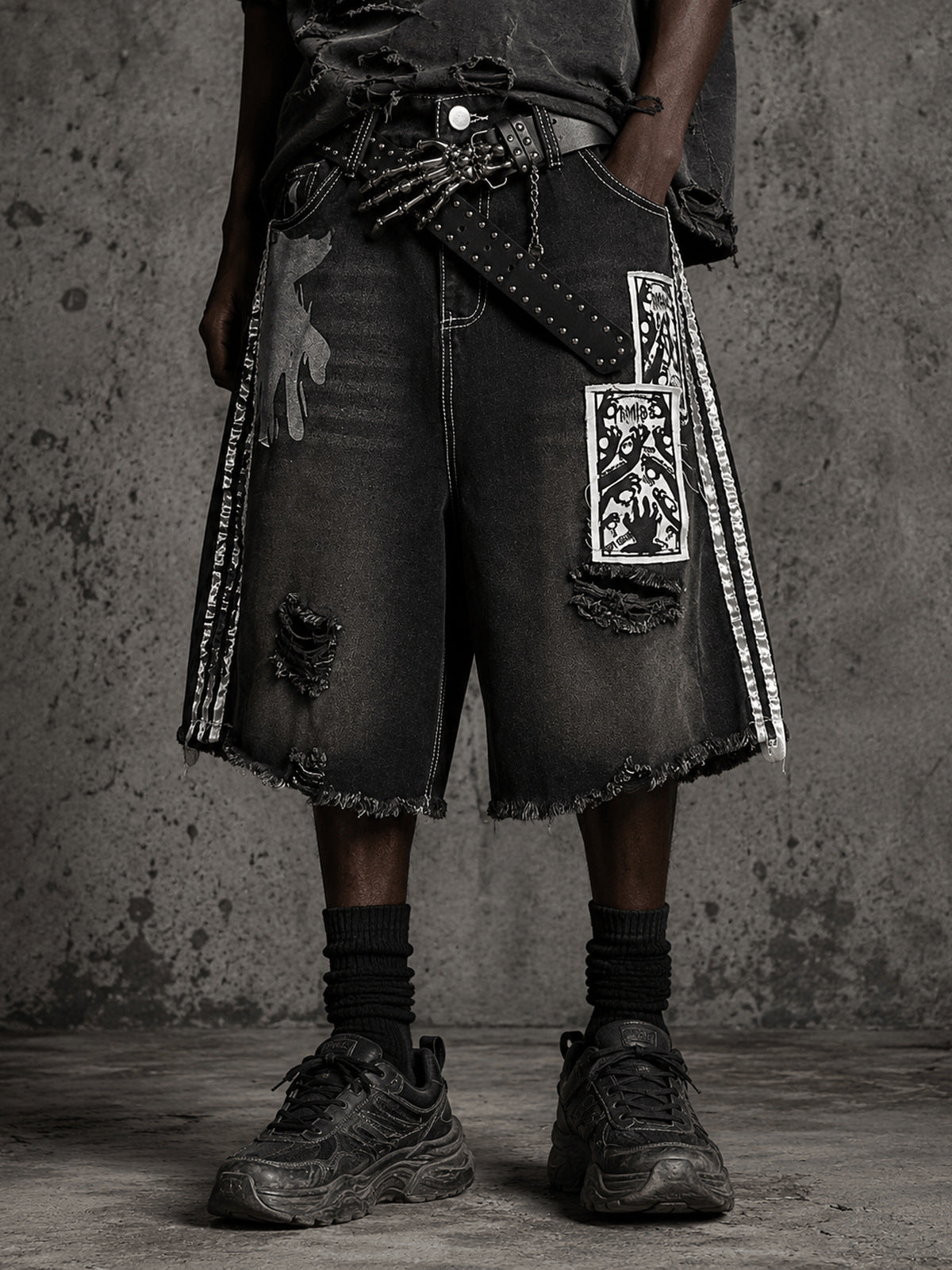 Black Baggy Jorts with Gothic Patch Prints – on model, front close crop | XoKool