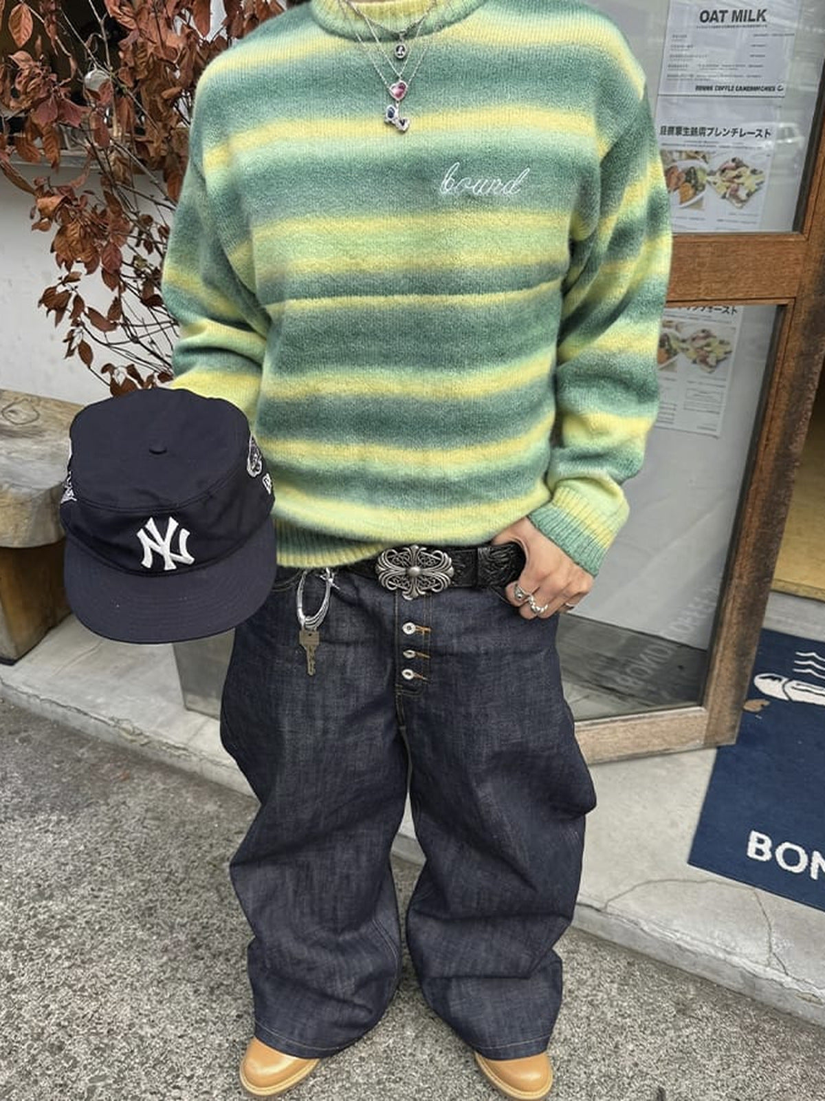 Black Embossed Belt with Cross Buckle – street photo, worn with jeans | XoKool