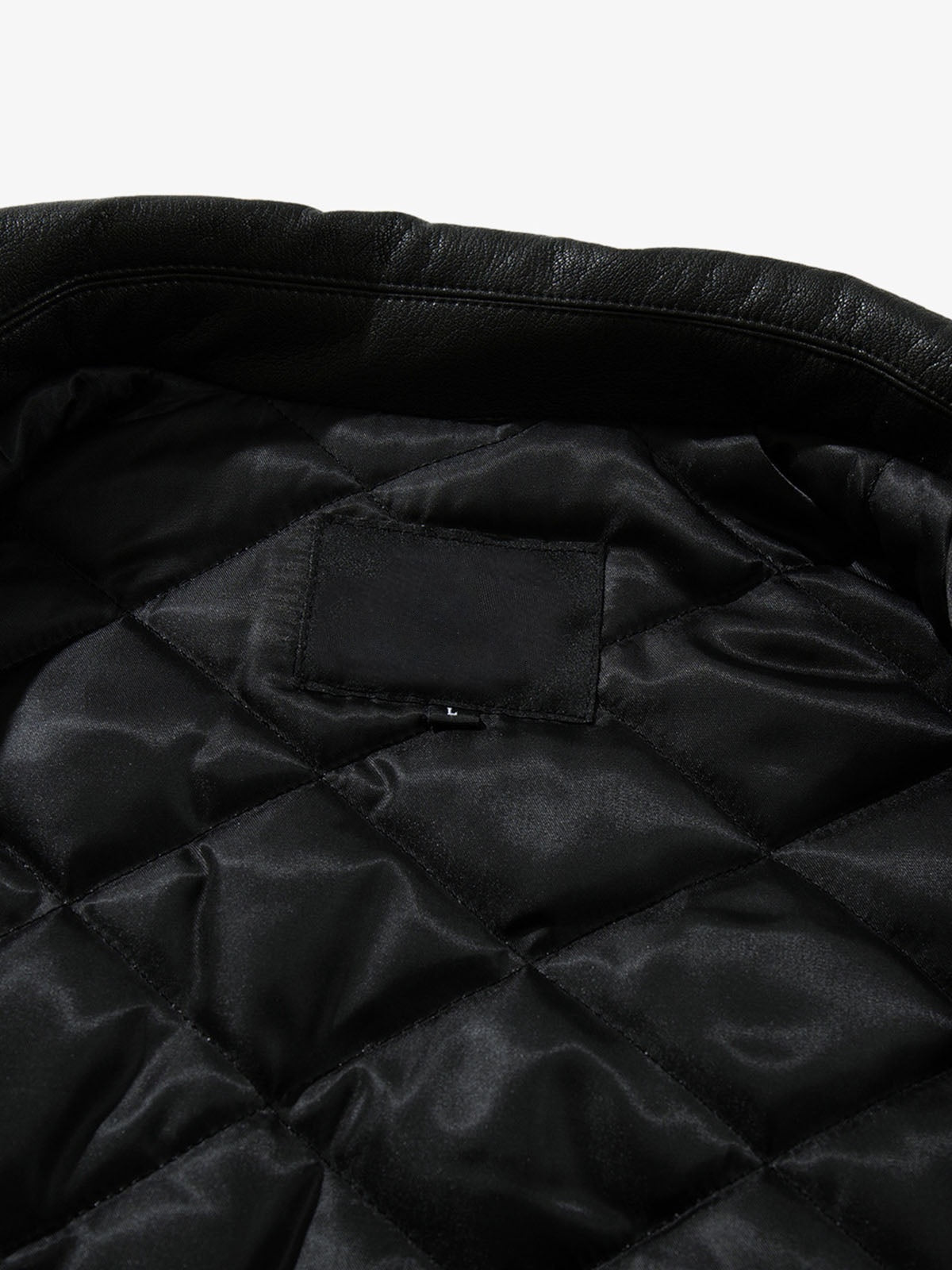 Black Faux Leather Collared Zip Jacket – Black, quilted lining close-up | XoKool
