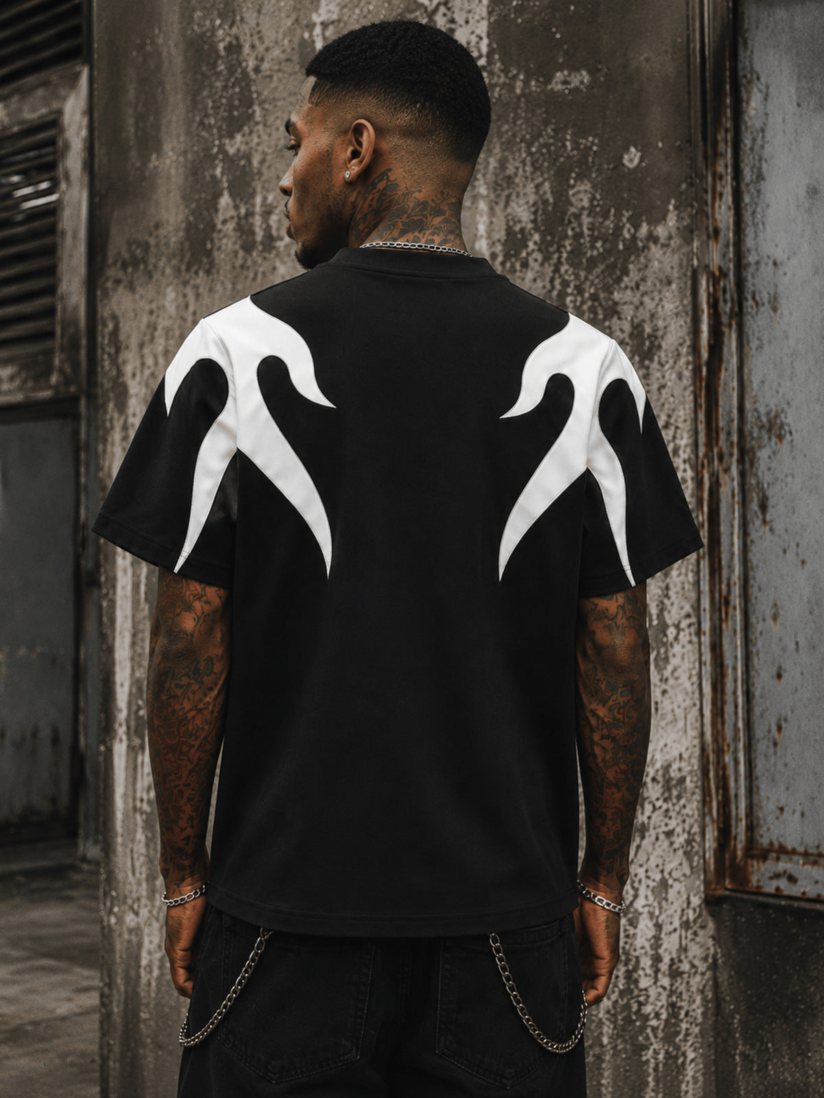 Black Flame T Shirt with Stitched Panels – on model, back, street | XoKool