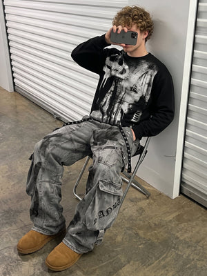 Paint drip long sleeve shirt – on model seated | XoKool