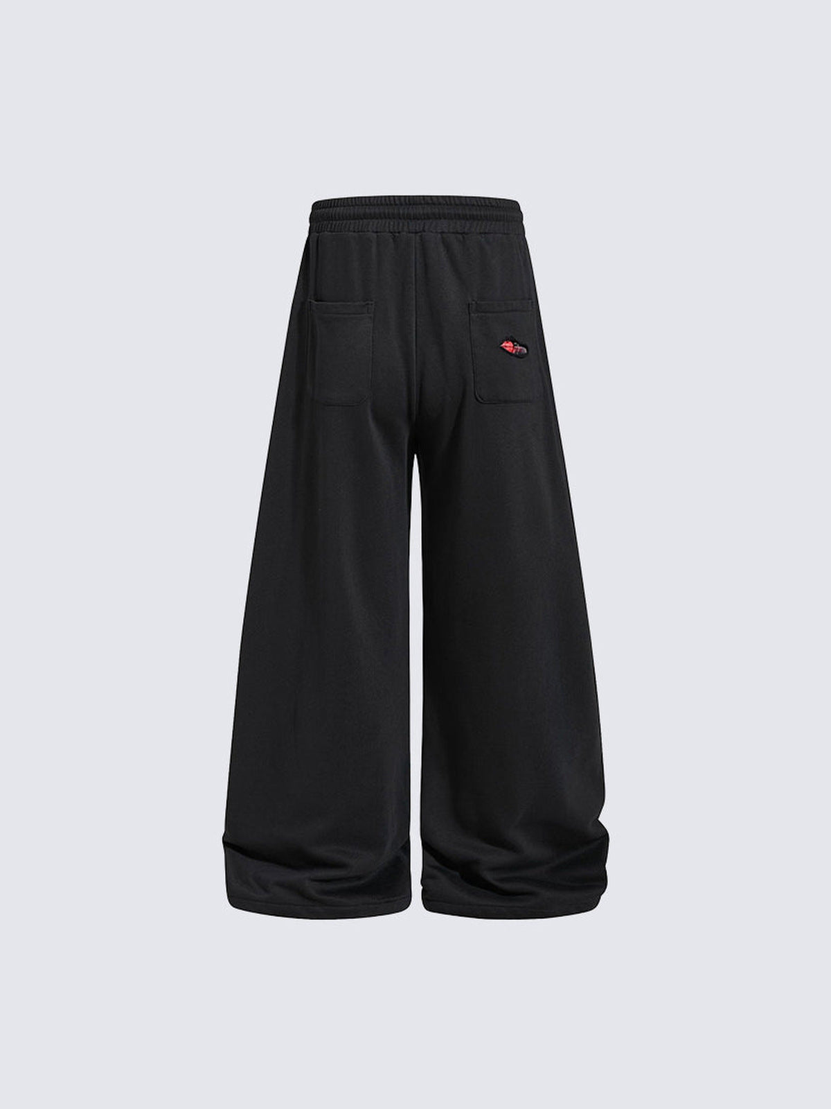 Schwarze Ripped Jogginghose mit Karo-Patches – Rückansicht | XoKool