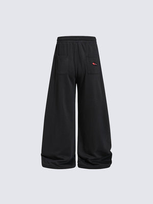 Schwarze Ripped Jogginghose mit Karo-Patches – Rückansicht | XoKool