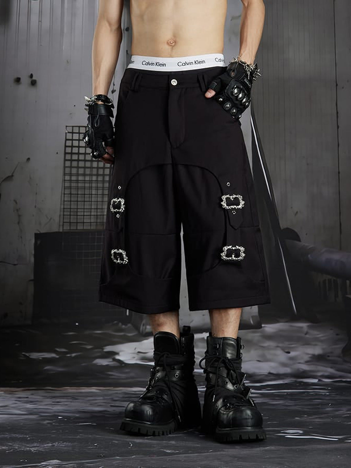 Black Tailored Shorts with Metal Buckle Straps – on model, front | XoKool