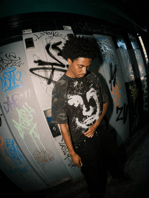 Camo Sleeve Raglan Tee with Distressed Face Graphic – Street photo, on model, front | XoKool