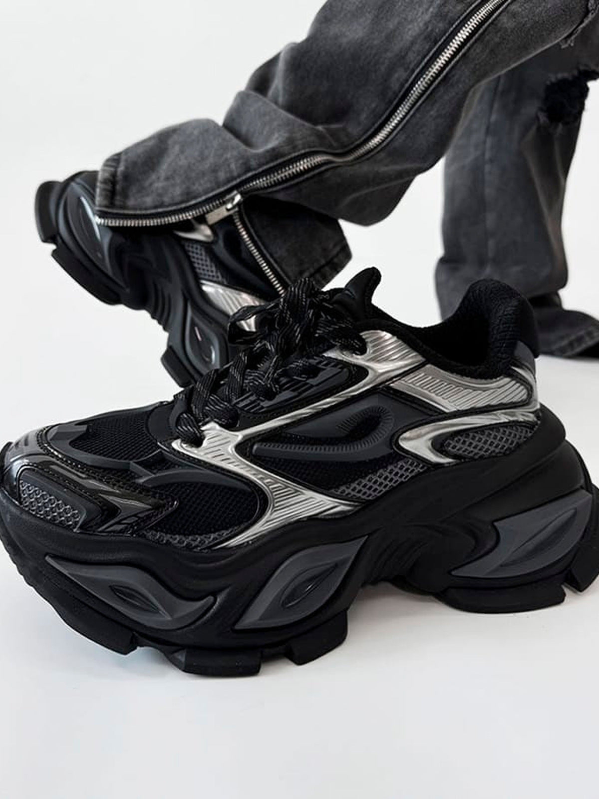 Chunky Platform Sneakers in Black and Silver – on model, angled | XoKool