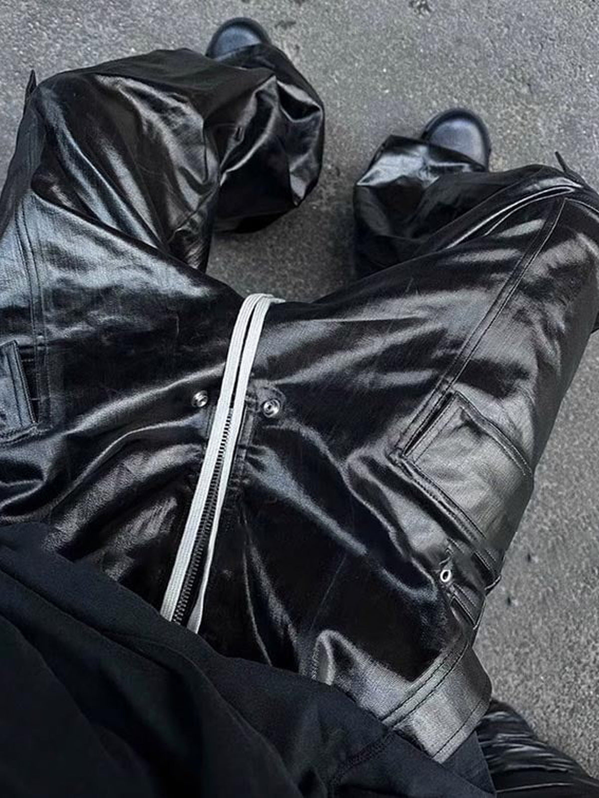 Coated cargo pants – Street photo, flat lay on ground | XoKool