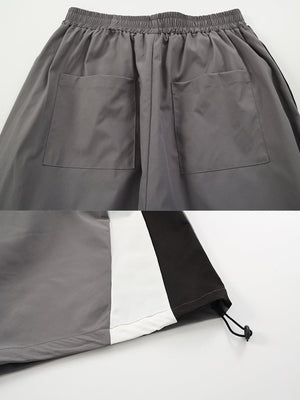 Colorblock track pants – Grey back pocket and toggle hem close-up | XoKool