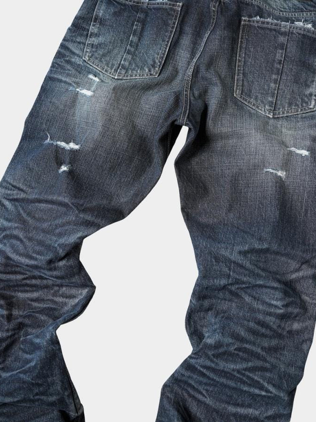 Jeans de pierna ancha desgastados – detalle de los rotos en la espalda y el muslo | XoKool