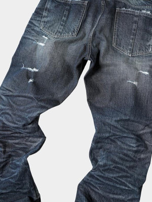 Jeans de pierna ancha desgastados – detalle de los rotos en la espalda y el muslo | XoKool