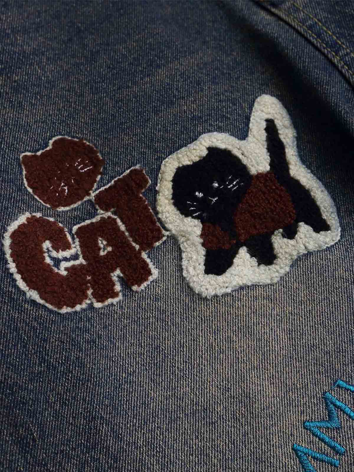 Cartoon patch jeans – 'CAT' patch close-up | XoKool