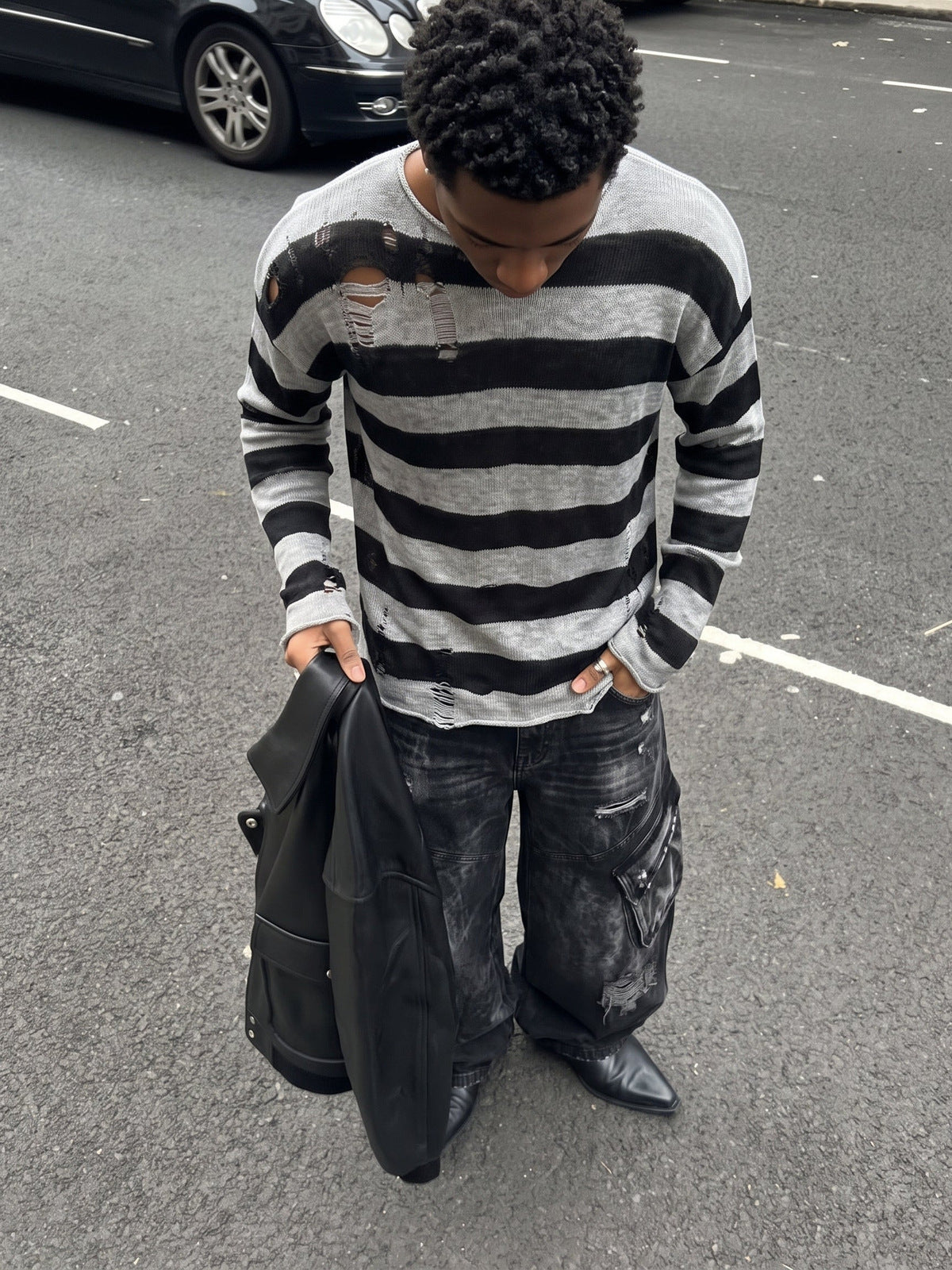 Distressed Black and Grey Striped Knit Sweater – street photo on model | XoKool