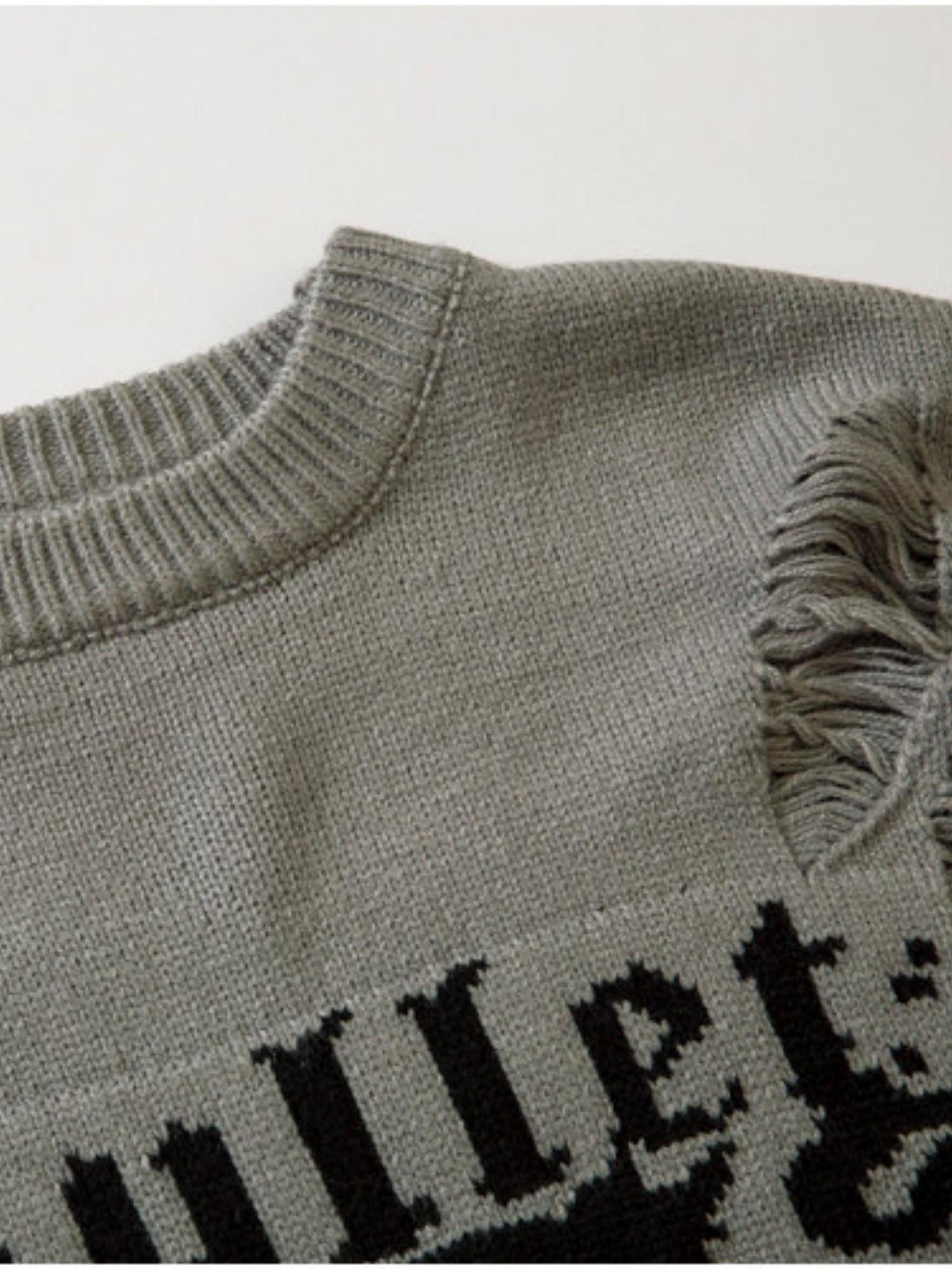 Face jacquard sweater – neckline and gothic letters close-up | XoKool