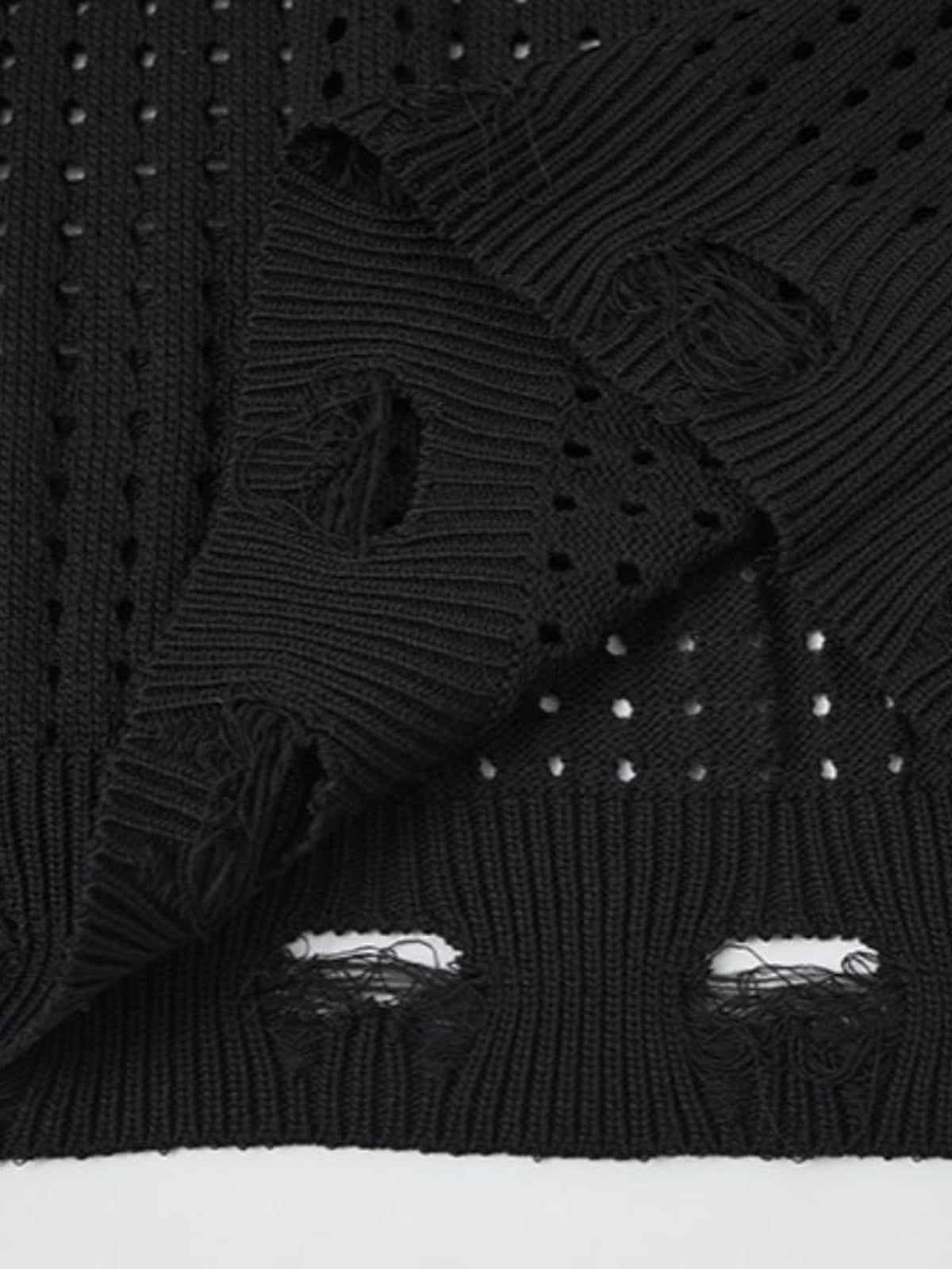 Strickweste mit Stern – Distressed-Saum Nahaufnahme | XoKool