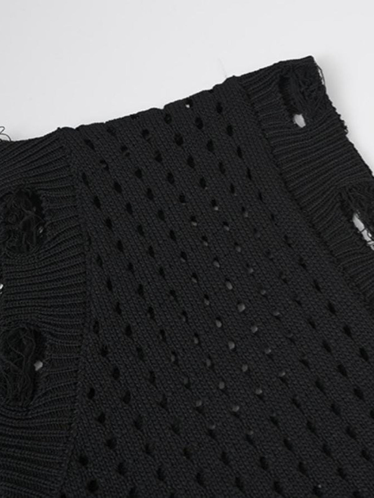 Strickweste mit Stern – Distressed-Saum Nahaufnahme | XoKool