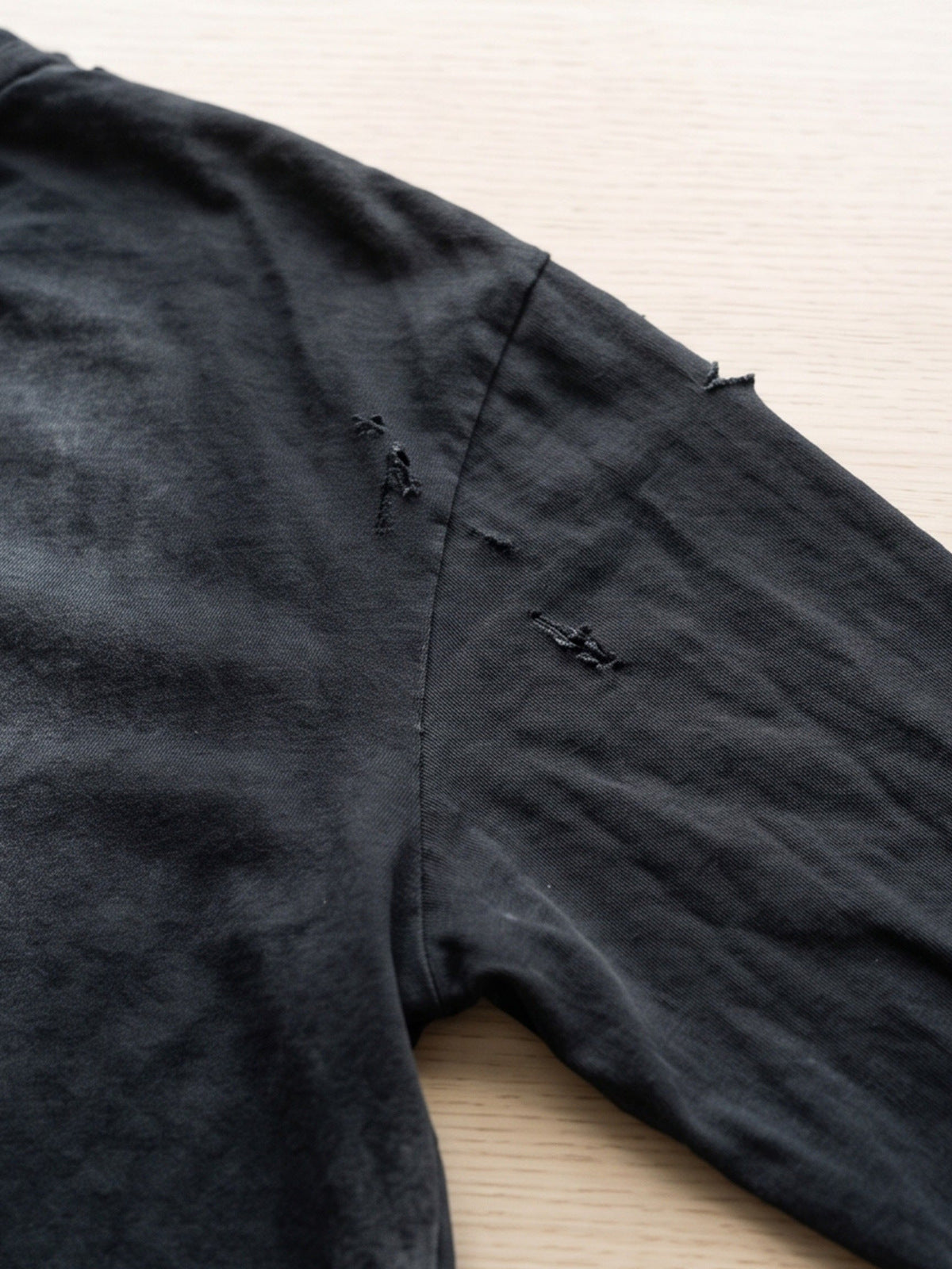 Distressed layered tee – shoulder rip close-up | XoKool