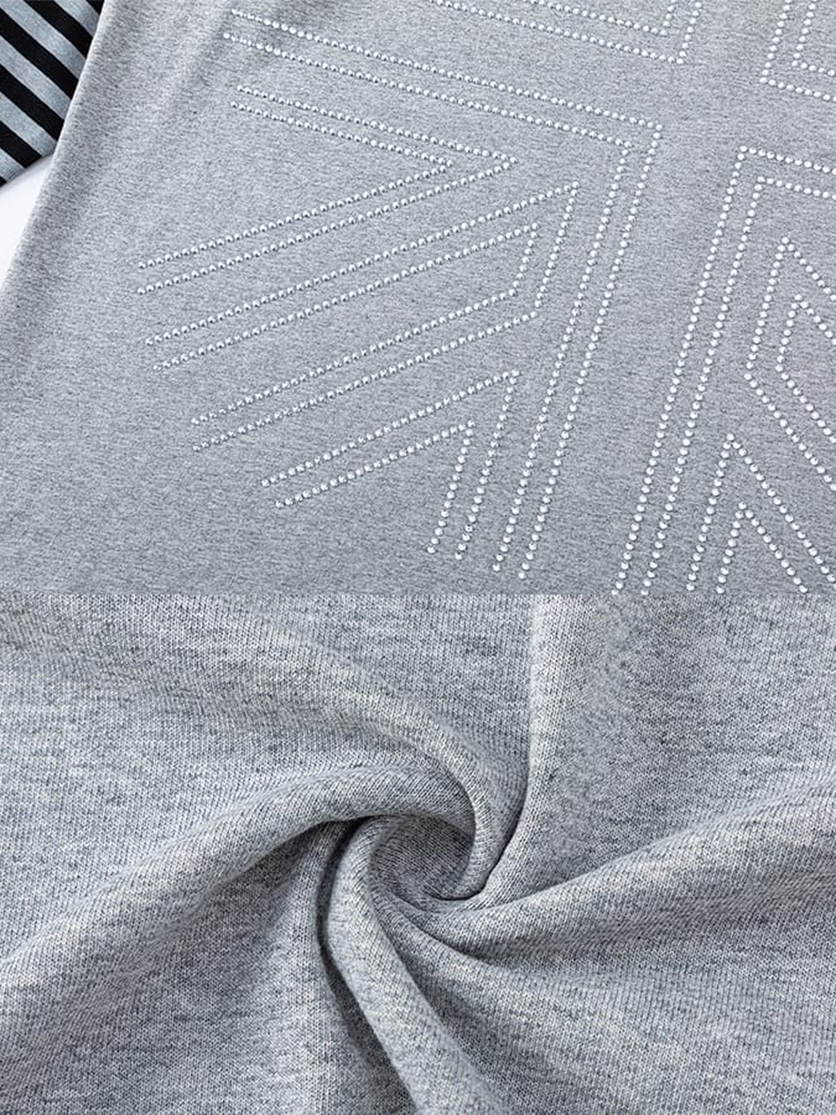 Layered striped hoodie – dotted graphic and fabric close-up | XoKool