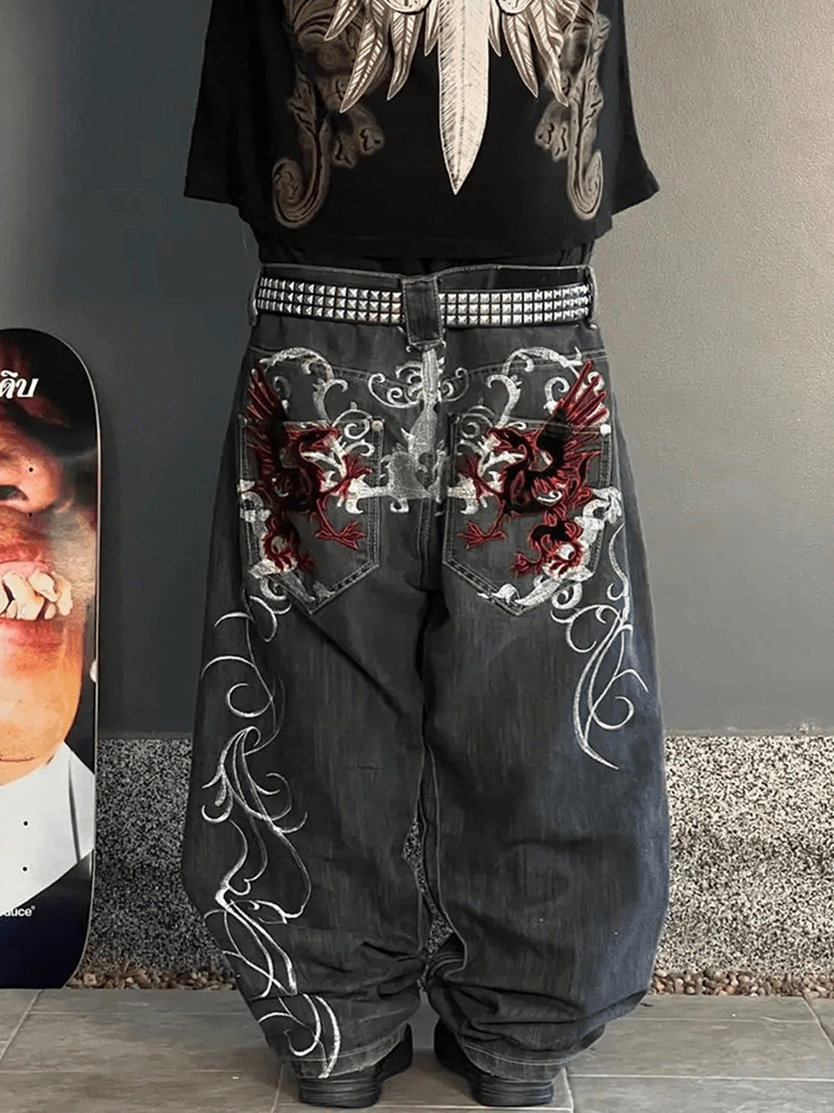 Dragon embroidered jeans – on model, back close, street | XoKool