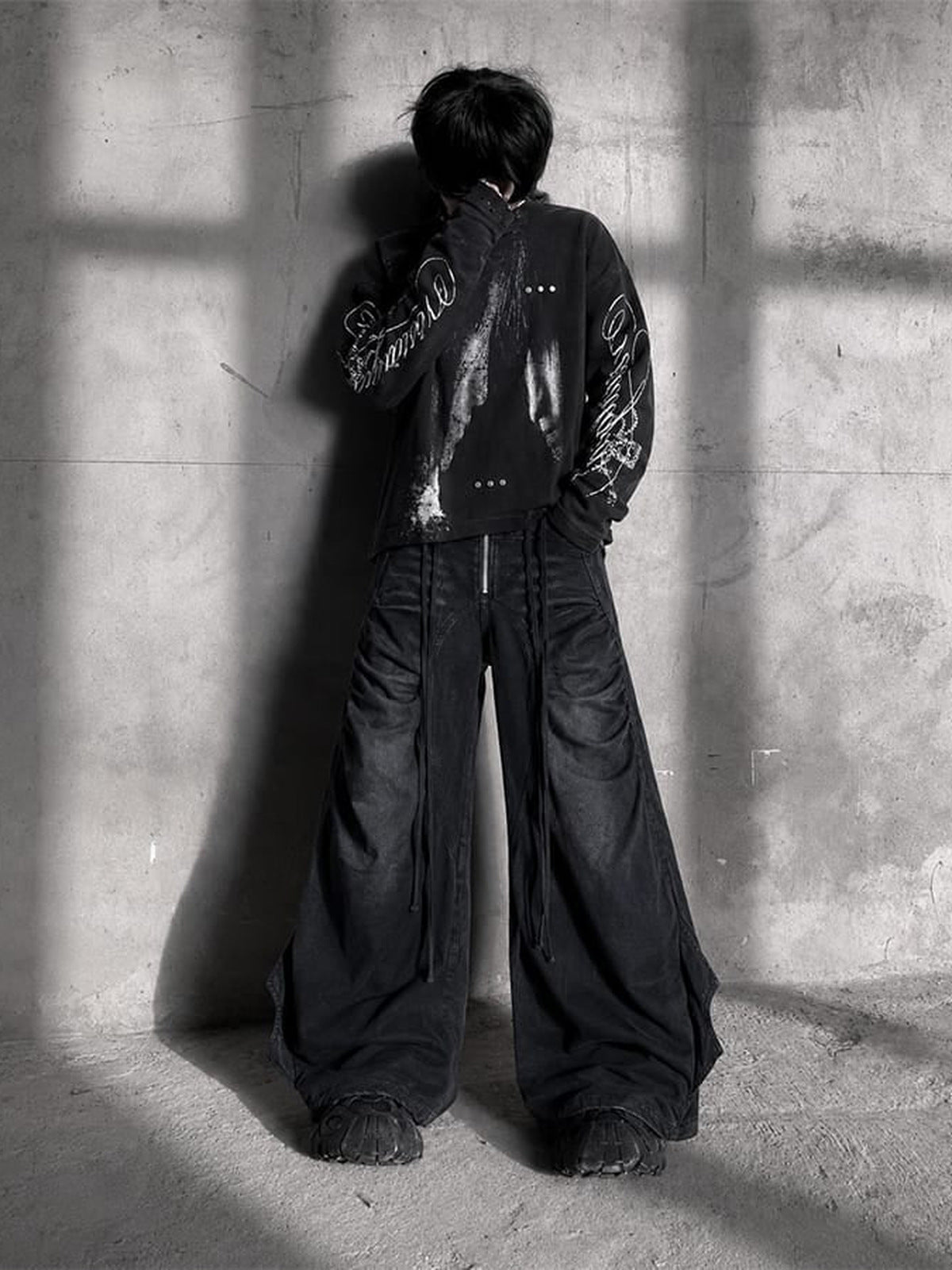 Drawstring Wide Leg Jeans with Flared Side Panels – Black on model, back (street photo) | XoKool