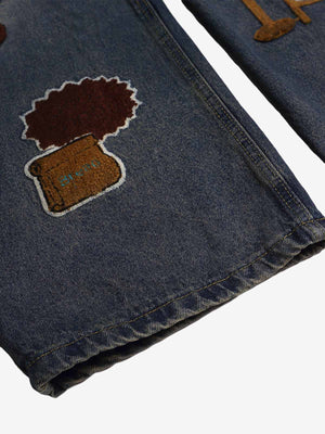 Cartoon Patch Barrel Jeans in Vintage Wash – patch close-up, hem | XoKool