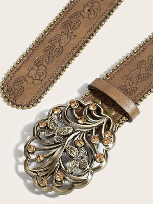 Cinturón western con flores en relieve y hebilla de mariposa – detalle de la hebilla y la correa en relieve | XoKool