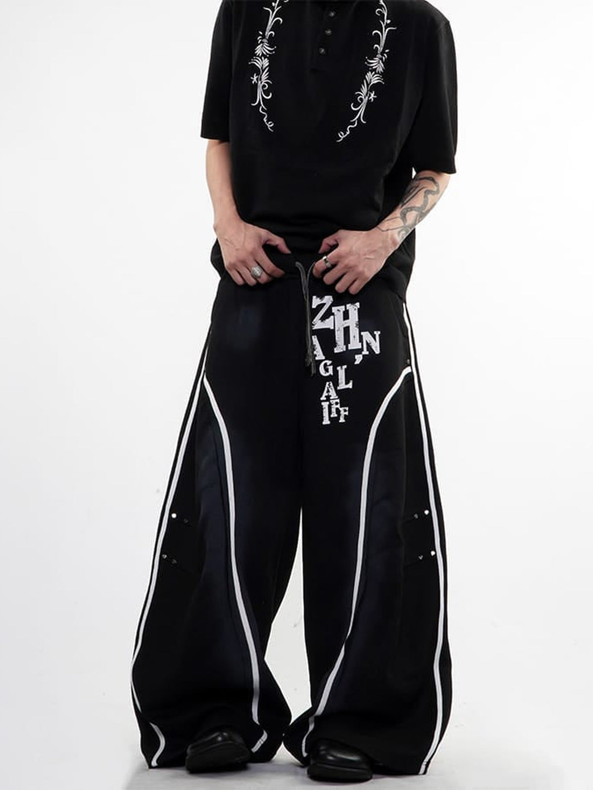 Faded Baggy Sweatpants with Contrast Piping – Black, on model front | XoKool