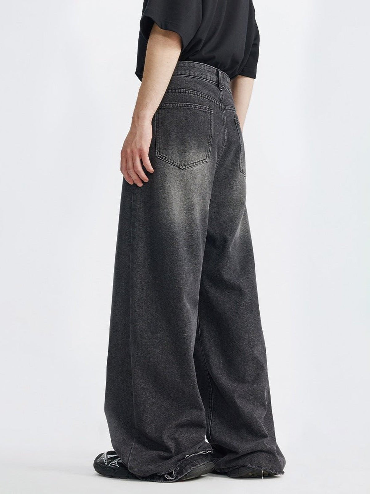 Faded Black Straight Leg Baggy Jeans – on model, back 3/4 | XoKool