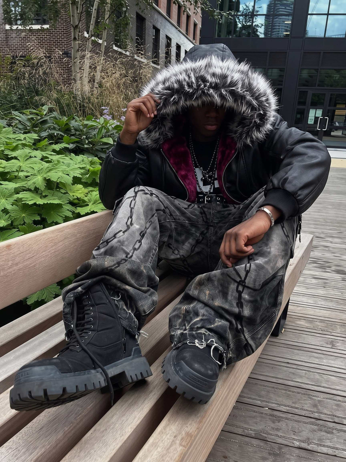 Faux leather fur hood bomber – street photo, seated | XoKool
