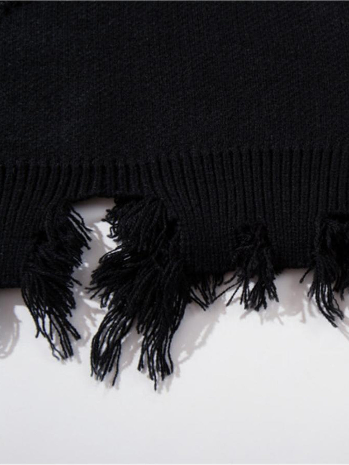 Gothic script sweater – Black, frayed hem close-up | XoKool