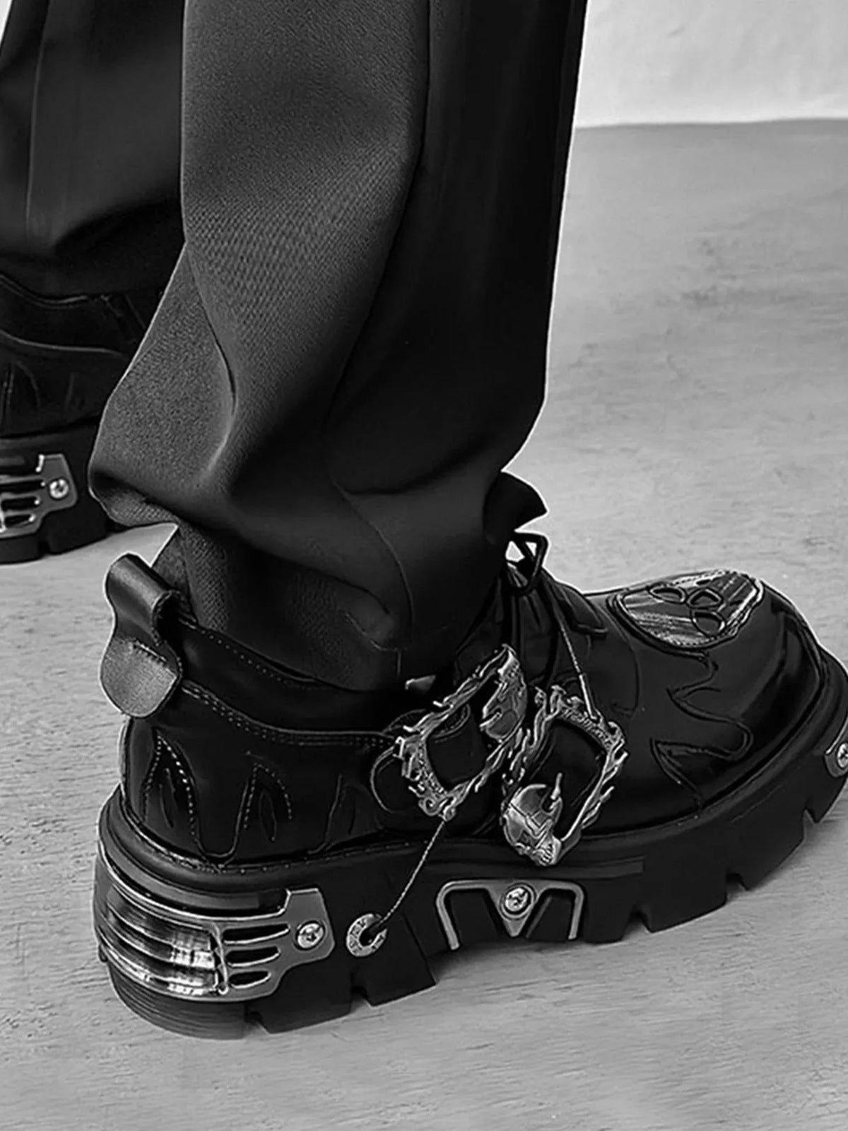 Gothic Platform Shoes with Flame Buckle and Metal Plates – On model, black, back/heel view | XoKool