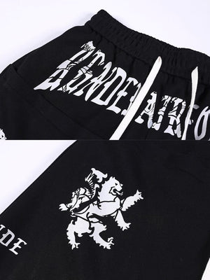 Gothic sweatpants – Black waist print and lion crest close-up | XoKool