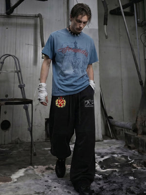 Embroidered sweatpants – Black, on model with blue tee | XoKool