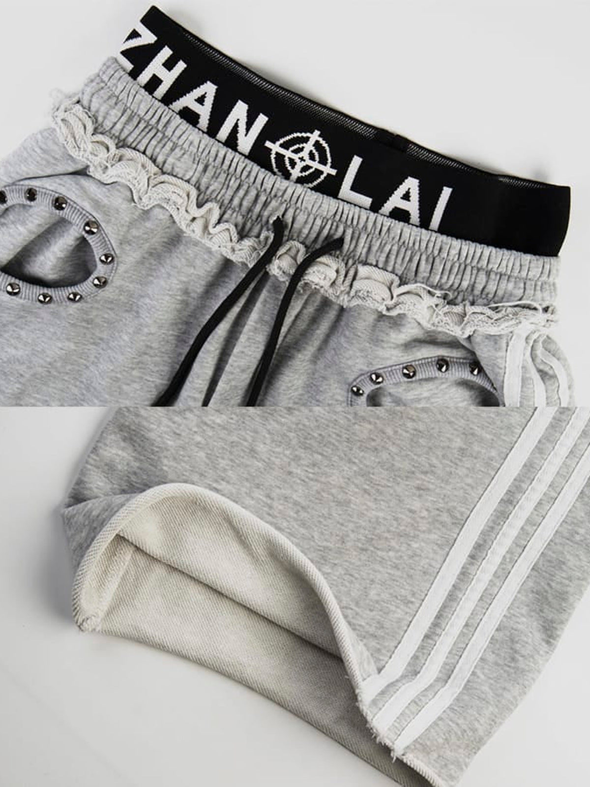 Pantalones deportivos con tachuelas – Detalle del emblema en la cintura, las tachuelas y el bajo con rayas, gris | XoKool