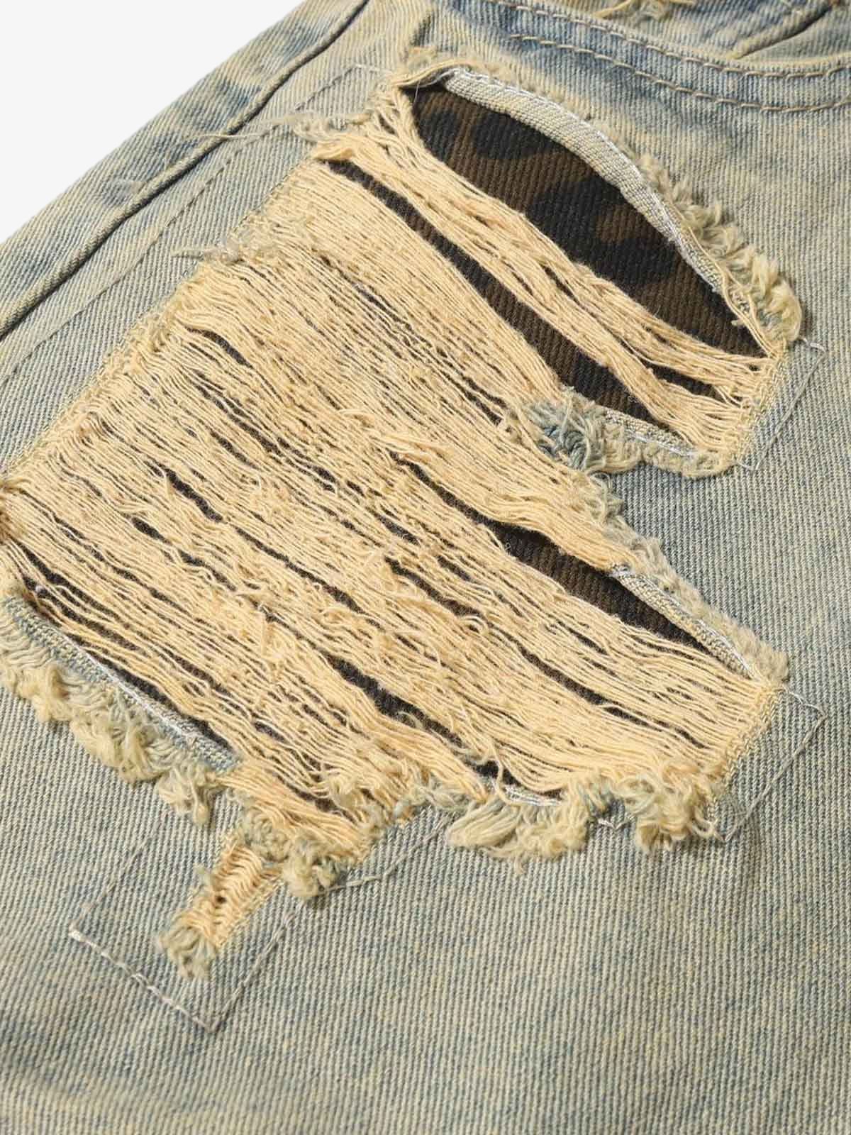 Ripped Baggy Jeans with Leopard Patches – large rip close-up | XoKool