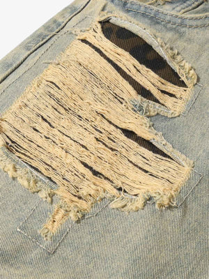 Ripped Baggy Jeans with Leopard Patches – large rip close-up | XoKool