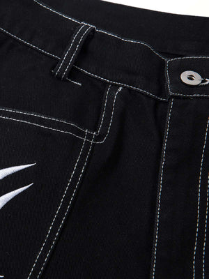 Tribal embroidered jeans – waistband + button close-up | XoKool