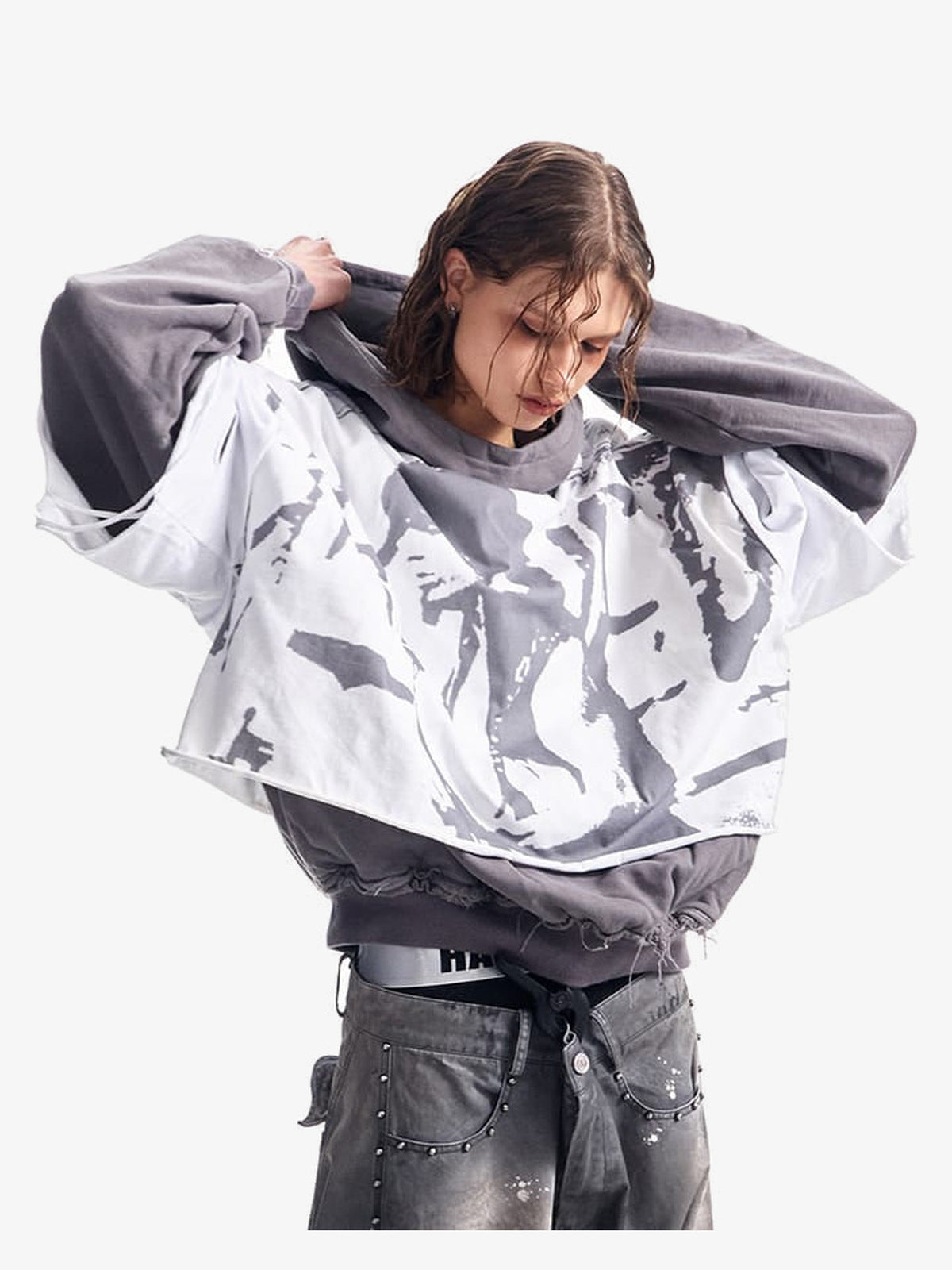 Layered Grunge Hoodie with Face Print Overlay – on model, arms raised | XoKool
