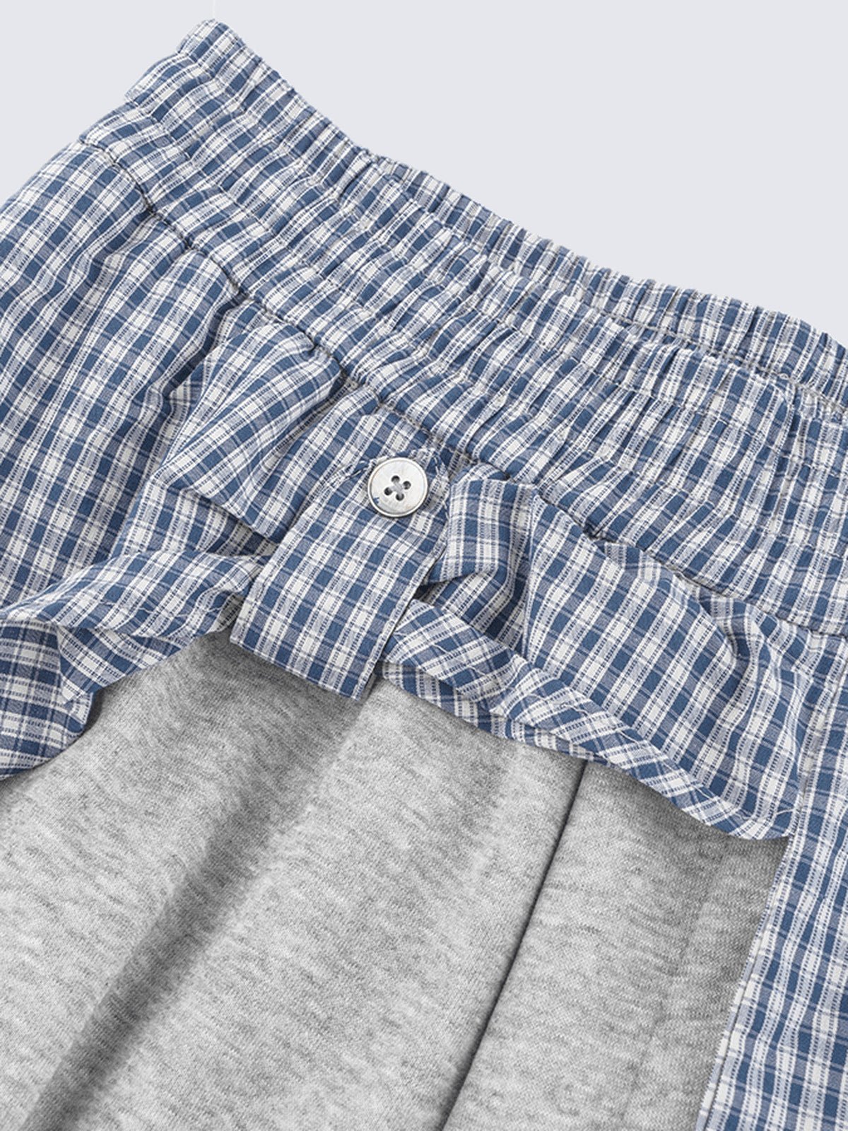 Layered sweatpants – shirt button close-up | XoKool