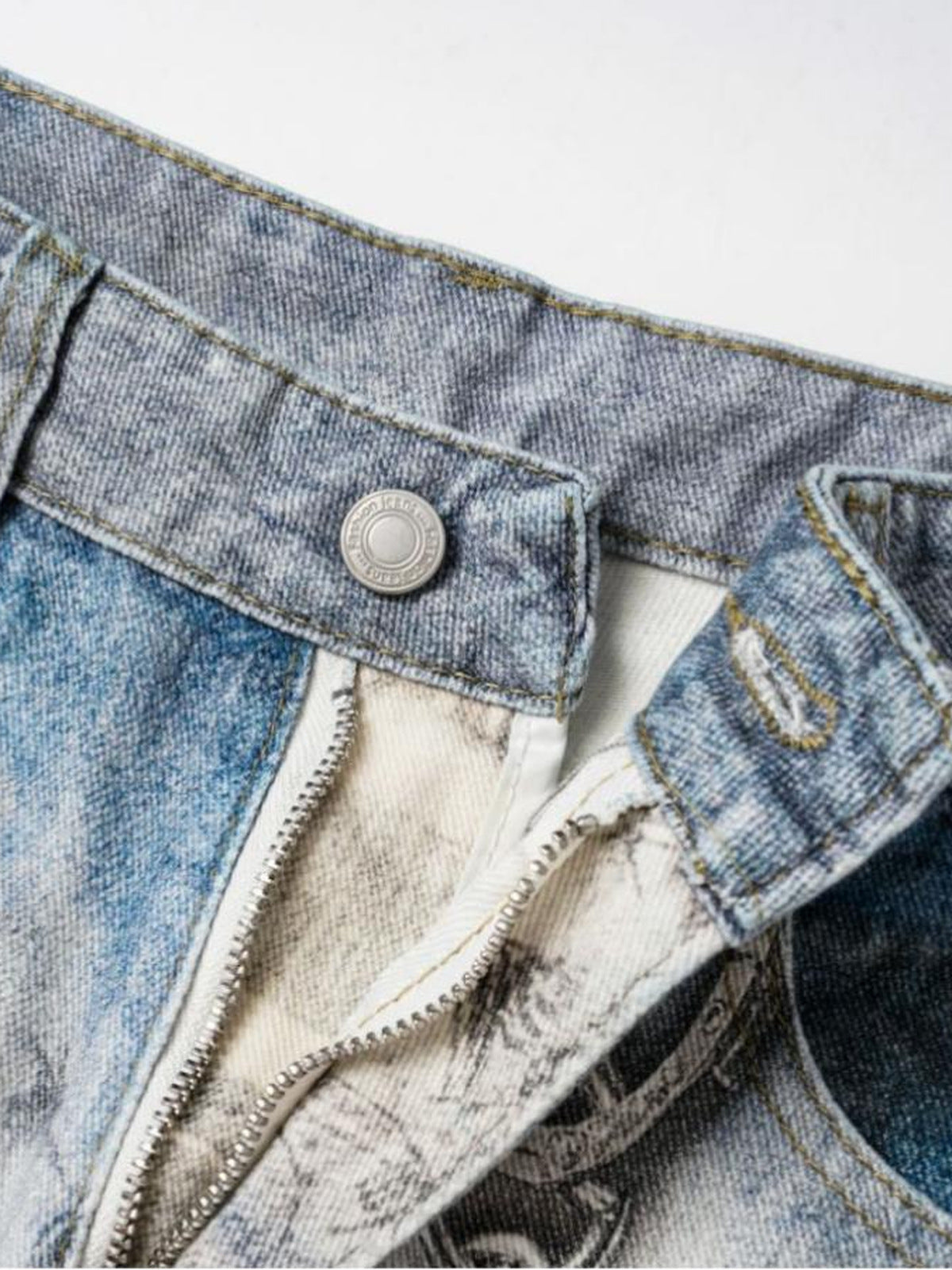 Light Blue Printed Baggy Jeans with Chain – zip fly and button close-up | XoKool