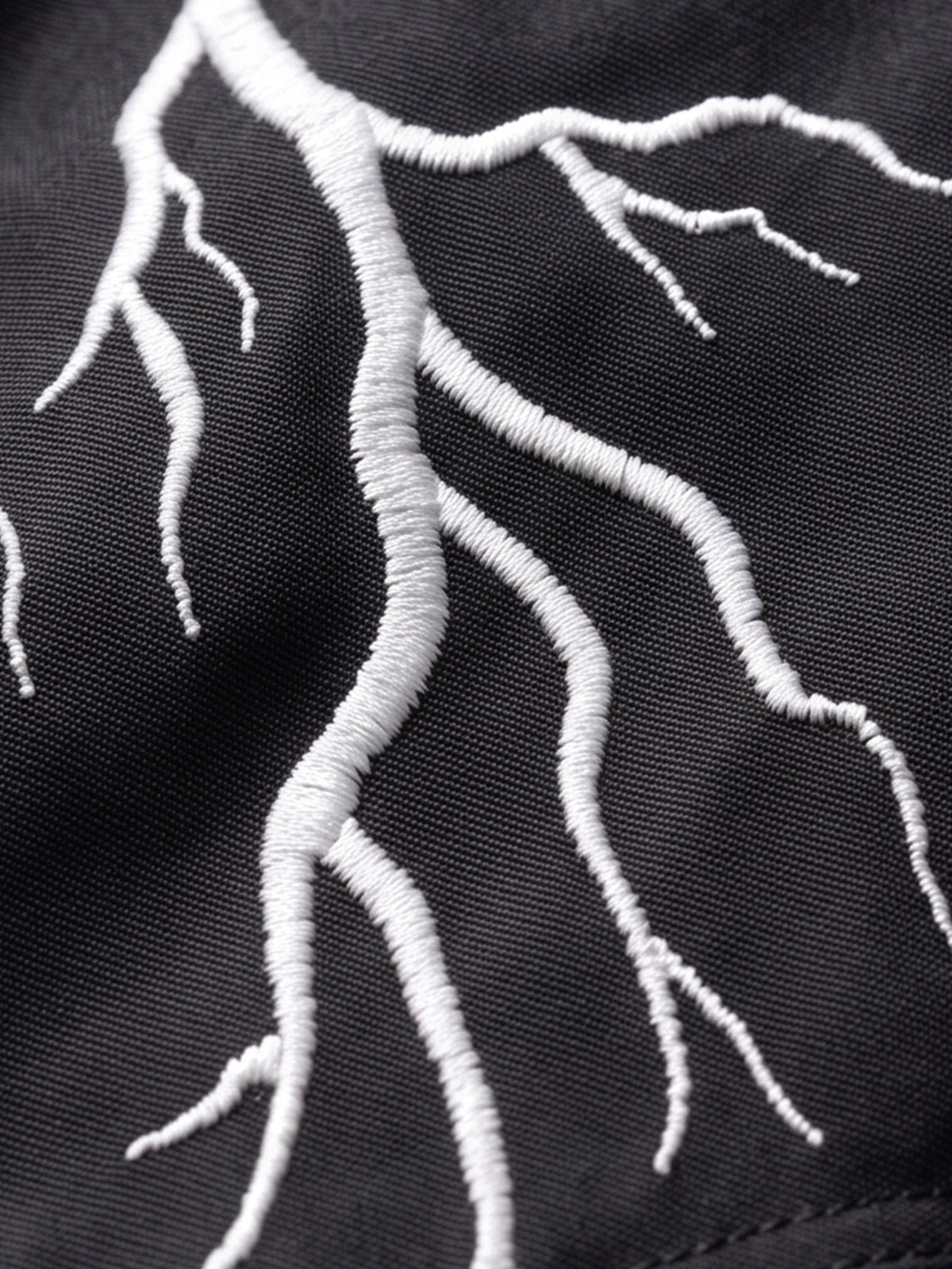 Lightning cropped bomber – lightning embroidery close-up | XoKool