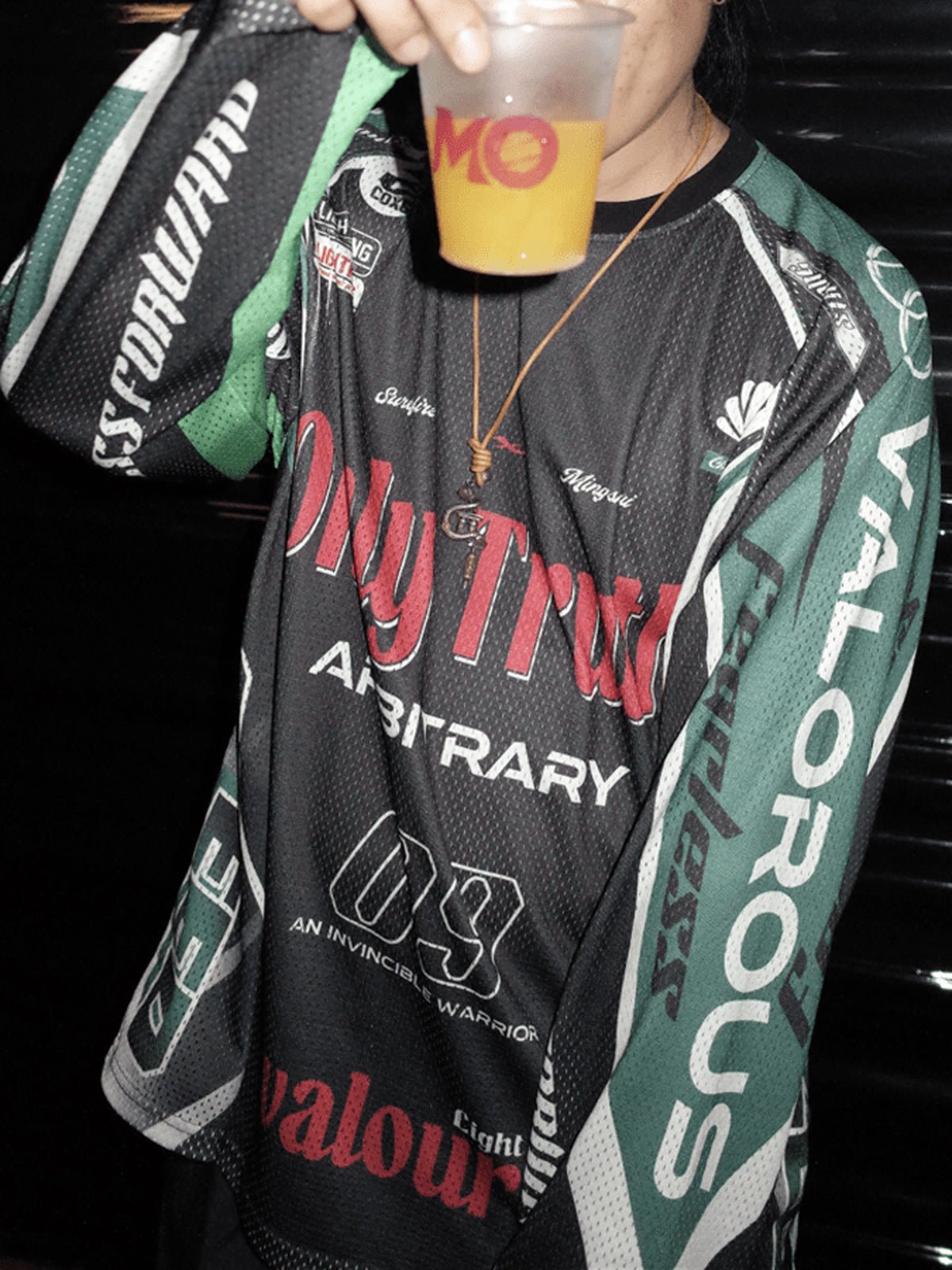 Motocross jersey – Black / Green, on model at night | XoKool