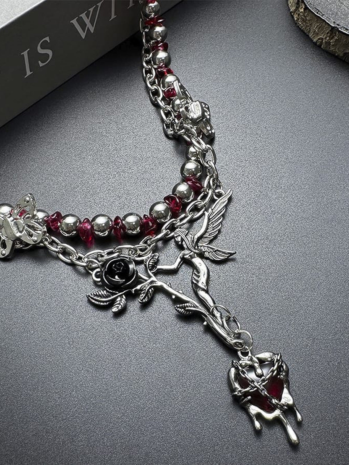 Red bead choker – close-up on dark surface | XoKool