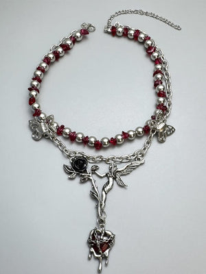 Red Bead Choker with Rose and Butterfly Charms – flat on grey | XoKool