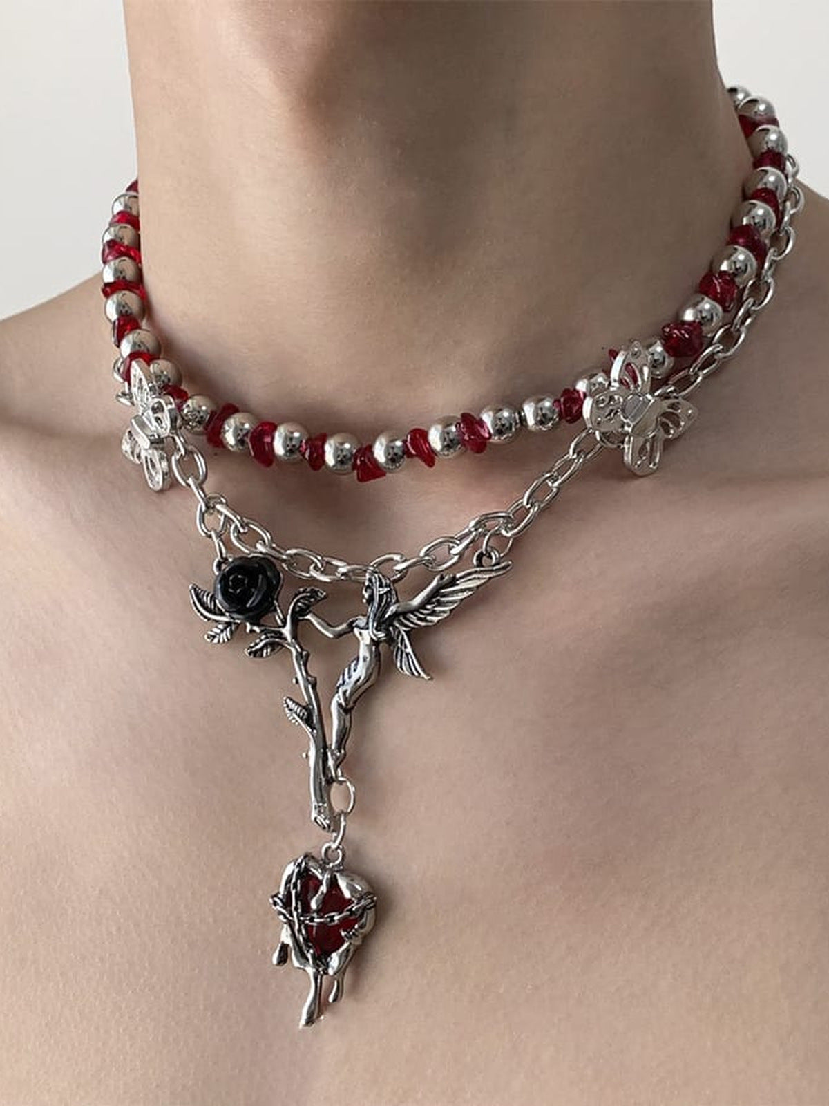 Red Bead Choker with Rose and Butterfly Charms – on model, neck close-up | XoKool