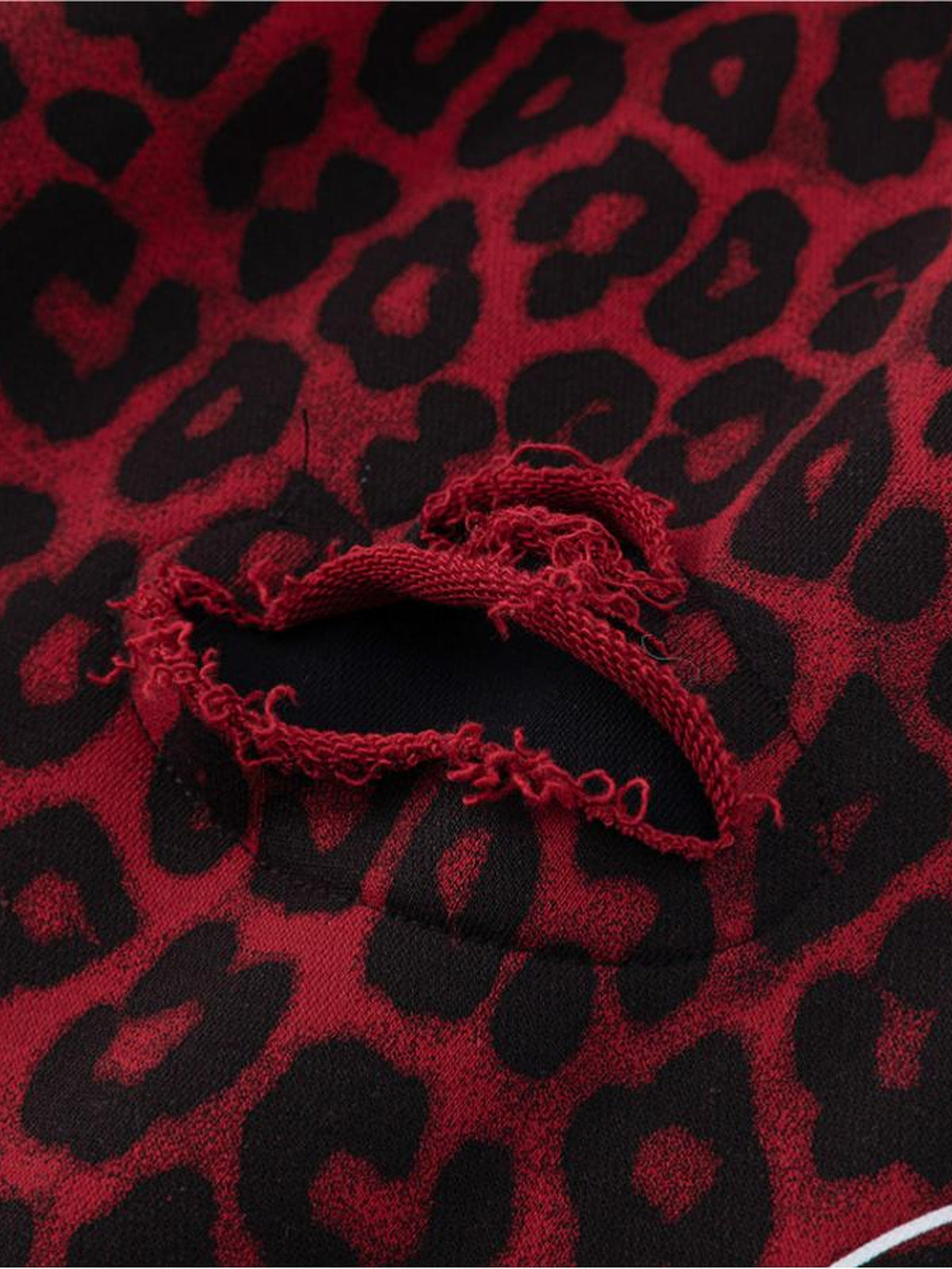 Leopard sweatpants – Ripped hole close-up | XoKool