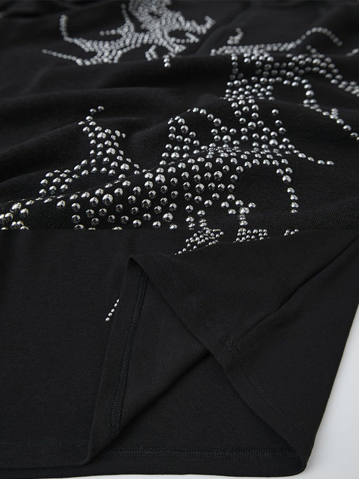 Rhinestone quarter zip shirt – Black, studs and hem slit close-up | XoKool