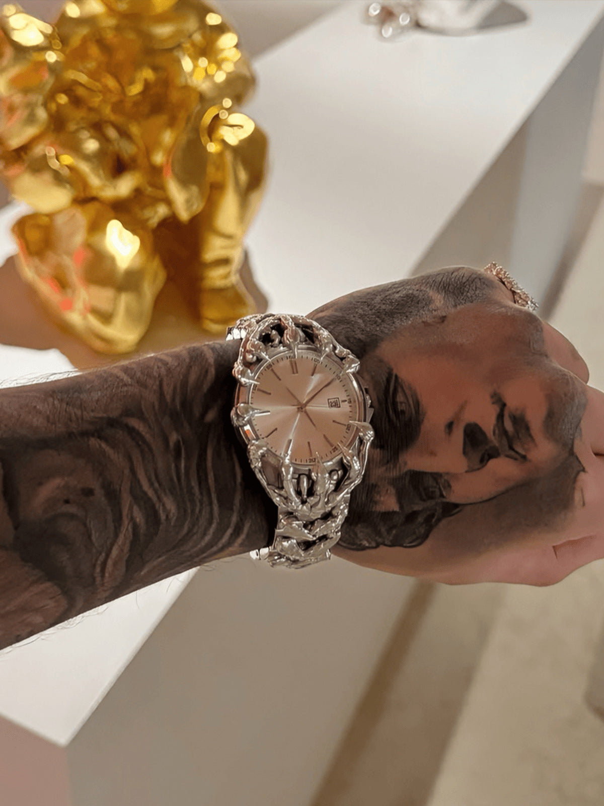 Claw bracelet watch – on tattooed wrist, gold skull decor | XoKool