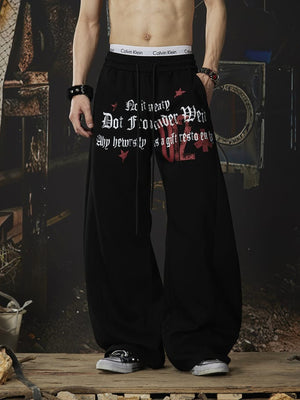 Graphic sweatpants – Black, on model front | XoKool