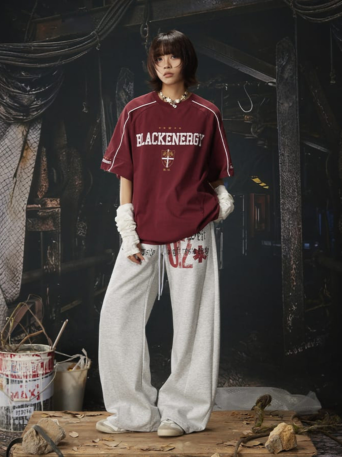 Graphic sweatpants – Heather Grey, on female model front with red tee | XoKool